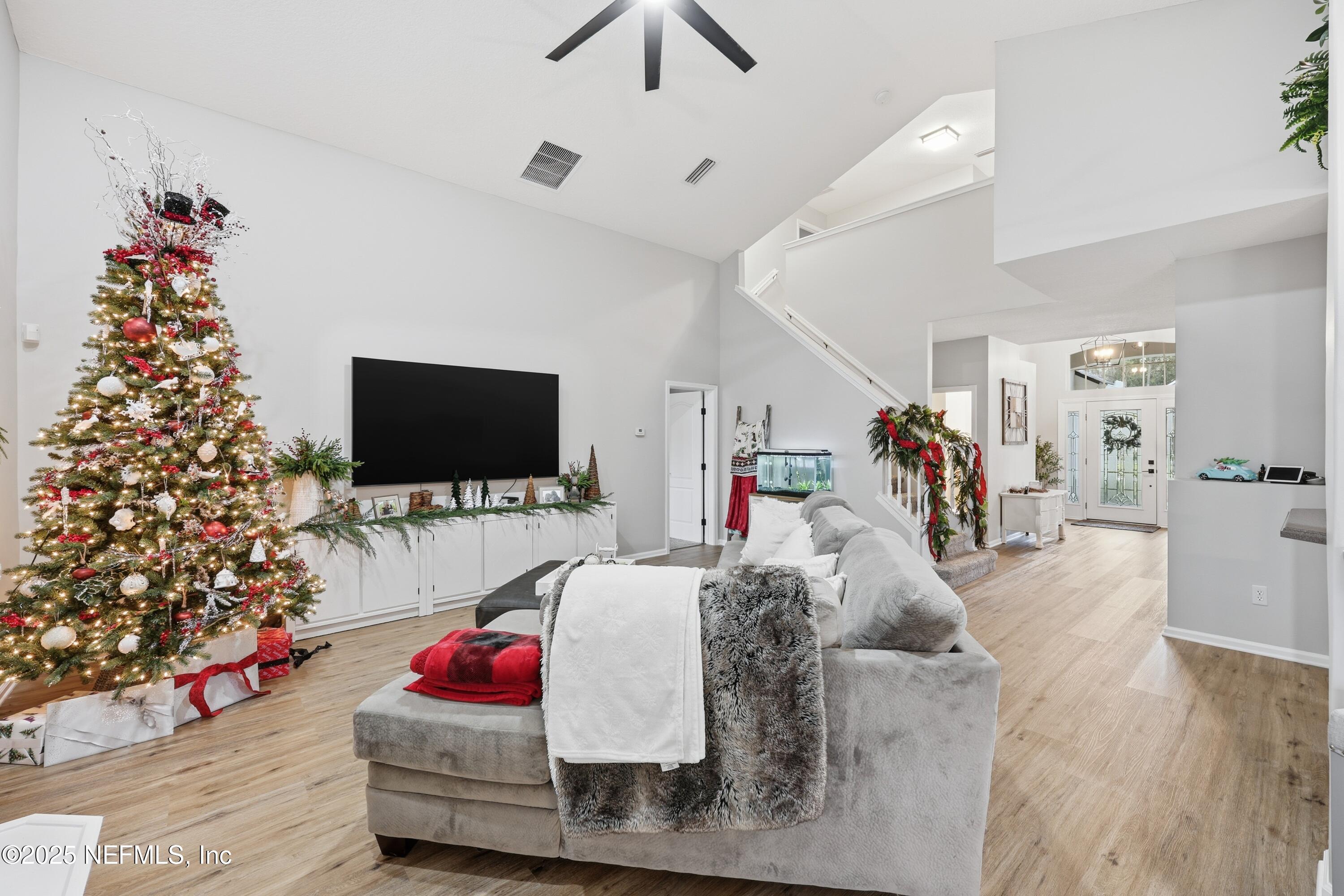 2301 Country Side Drive Fleming Island, FL 32003 - Photo 13 of 58 a living room with furniture and a flat screen tv