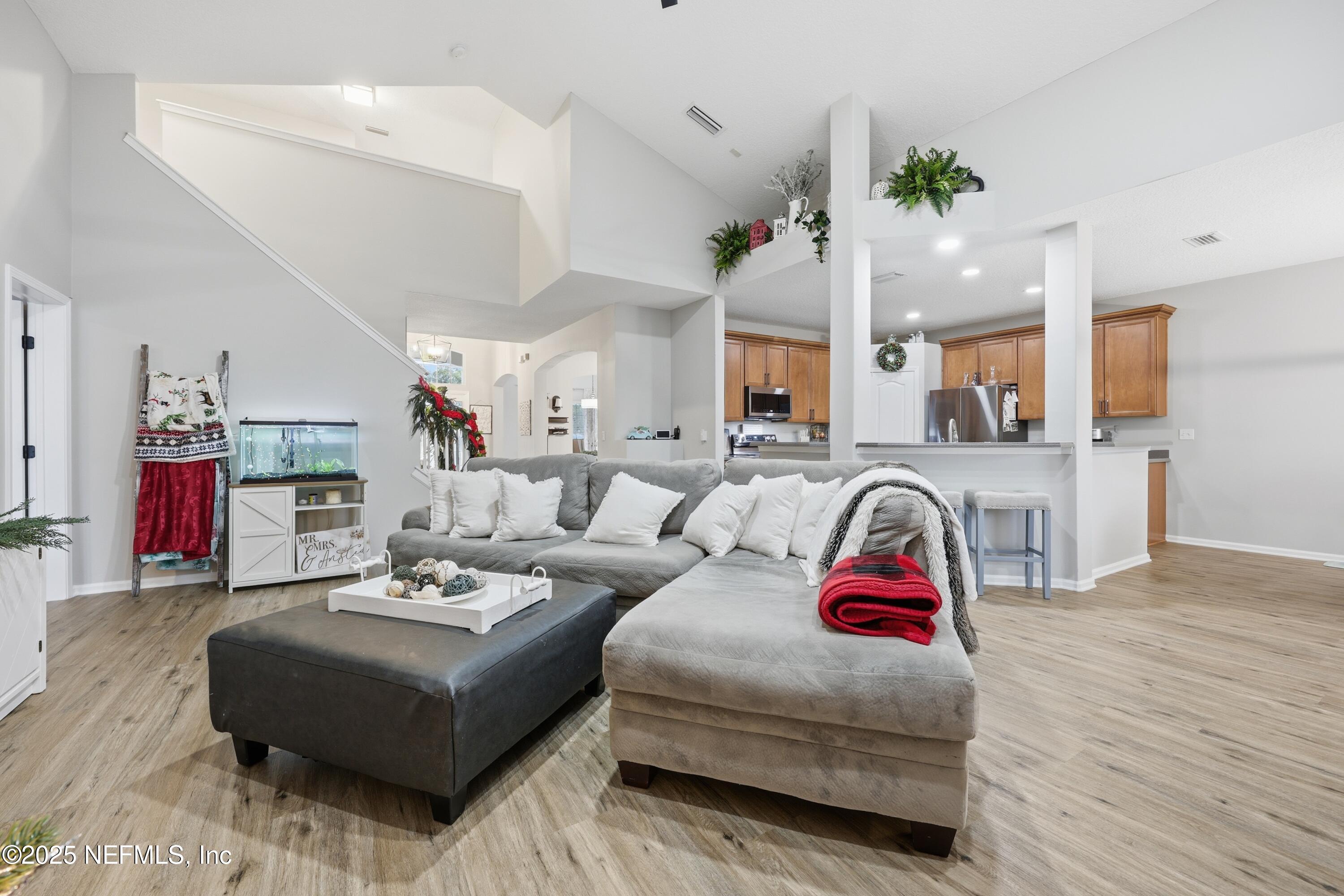 2301 Country Side Drive Fleming Island, FL 32003 - Photo 14 of 58 a living room with furniture and wooden floor