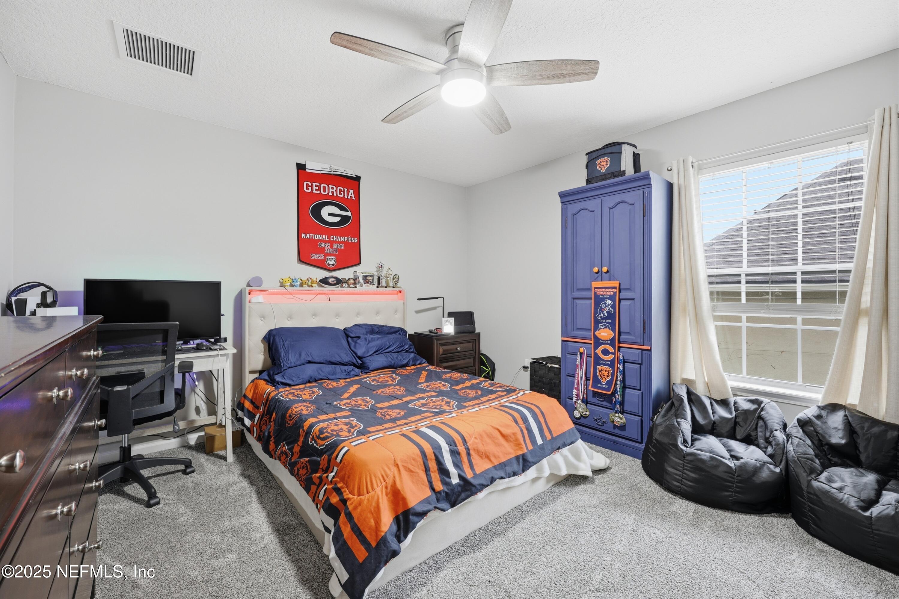 2301 Country Side Drive Fleming Island, FL 32003 - Photo 28 of 58 a bedroom with a bed furniture and a window