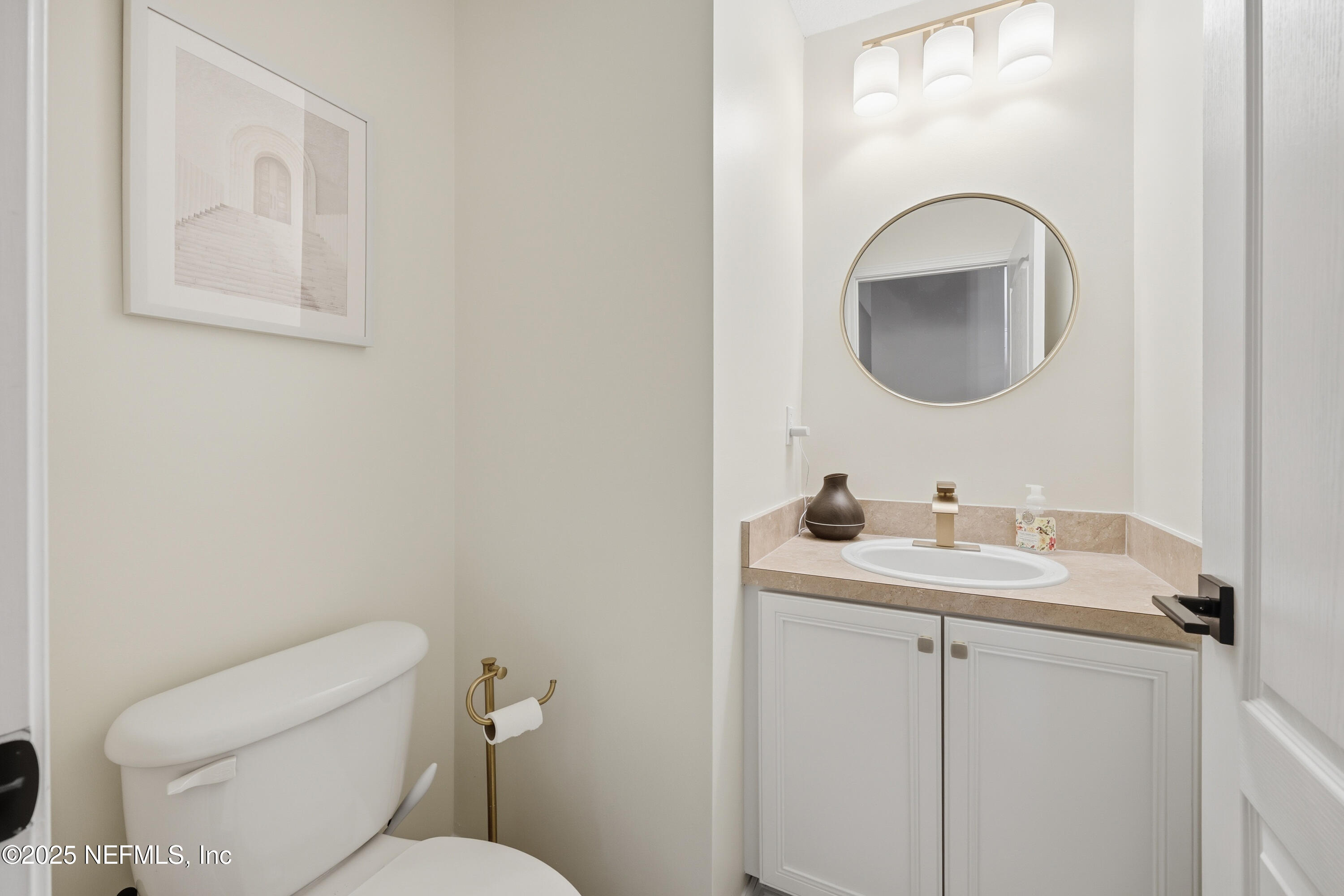 2301 Country Side Drive Fleming Island, FL 32003 - Photo 29 of 58 a bathroom with a toilet sink and mirror