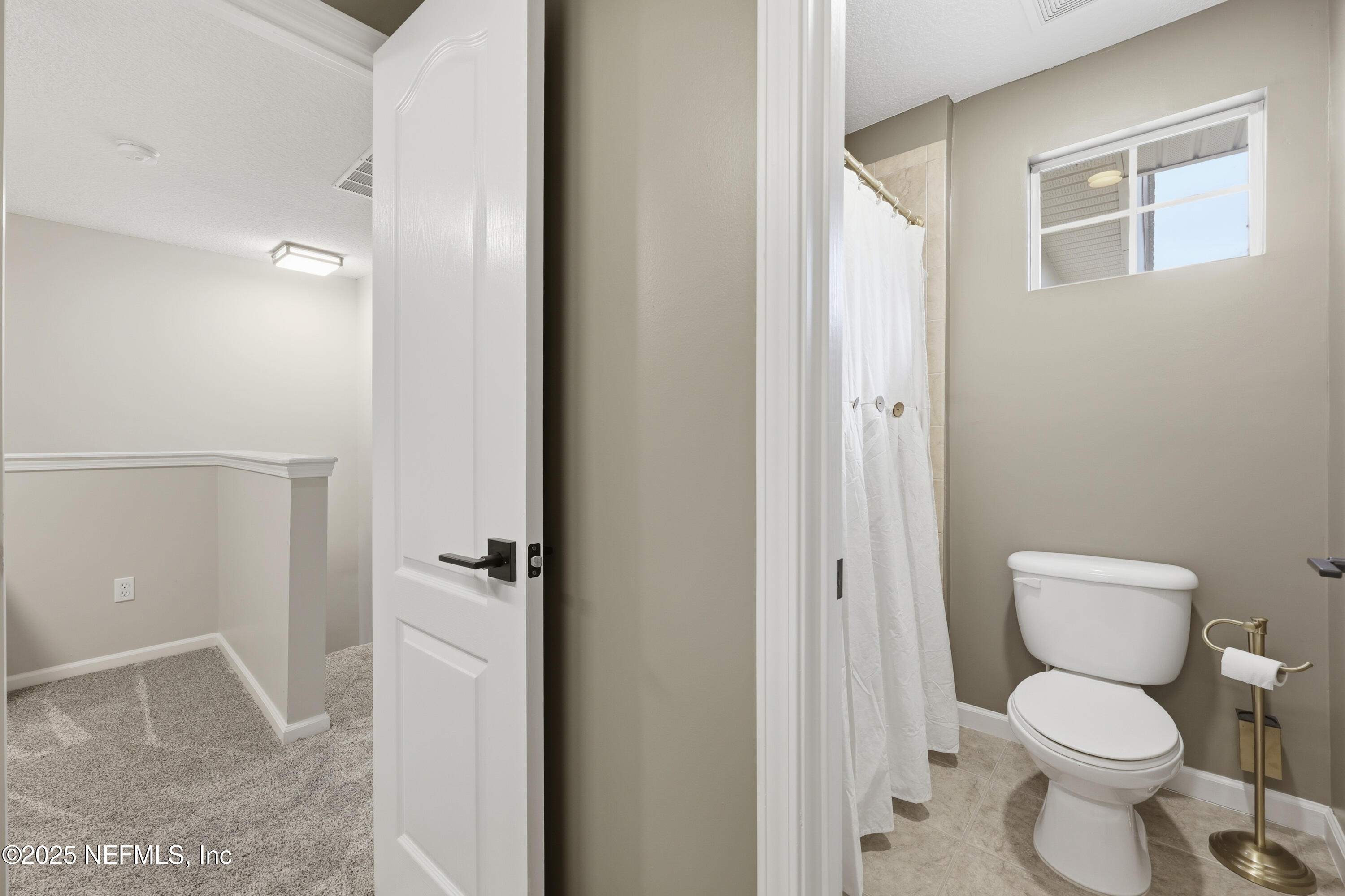 2301 Country Side Drive Fleming Island, FL 32003 - Photo 31 of 58 a white toilet sitting next to a bathroom sink