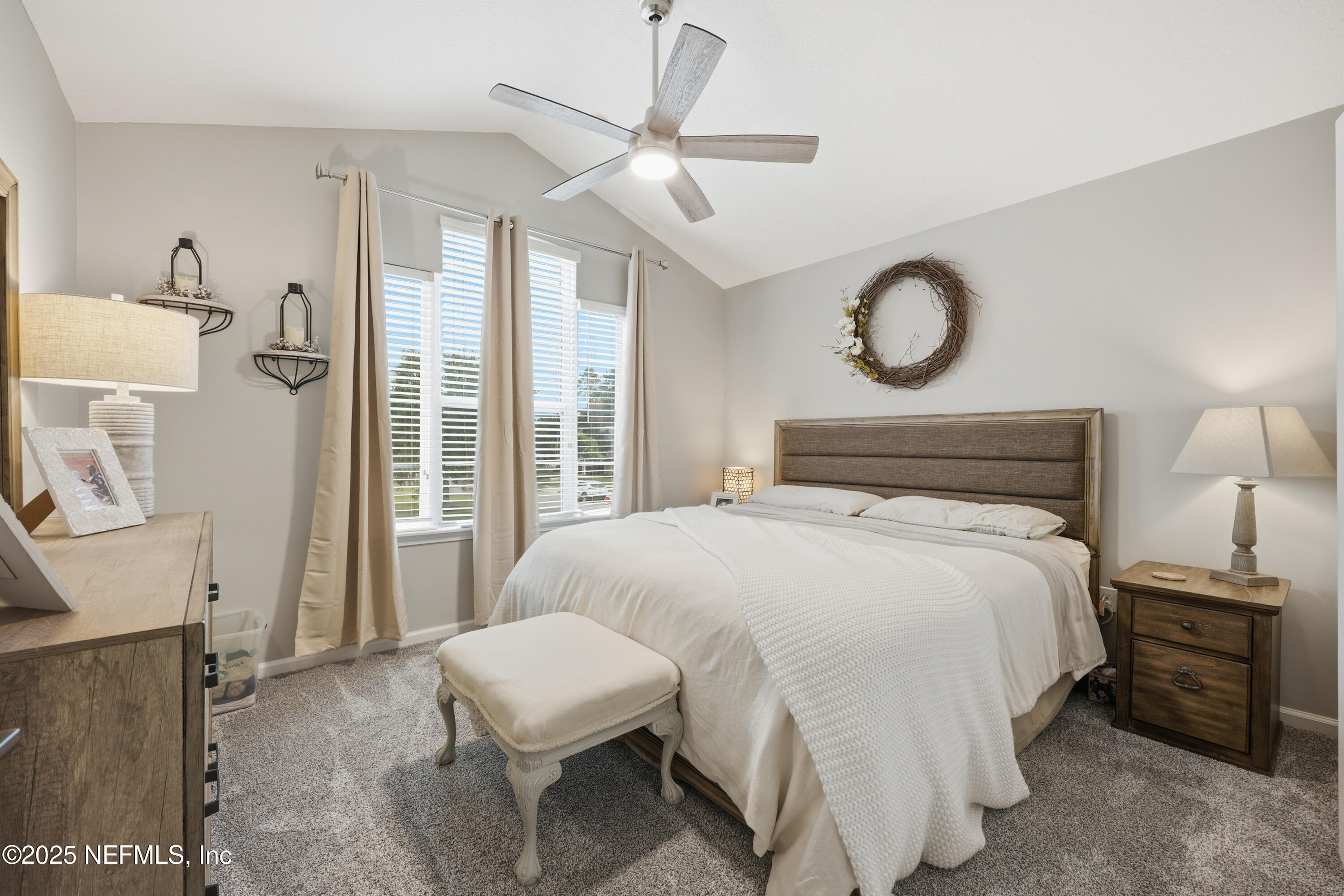 2301 Country Side Drive Fleming Island, FL 32003 - Photo 32 of 58 a bedroom with a bed and a chandelier