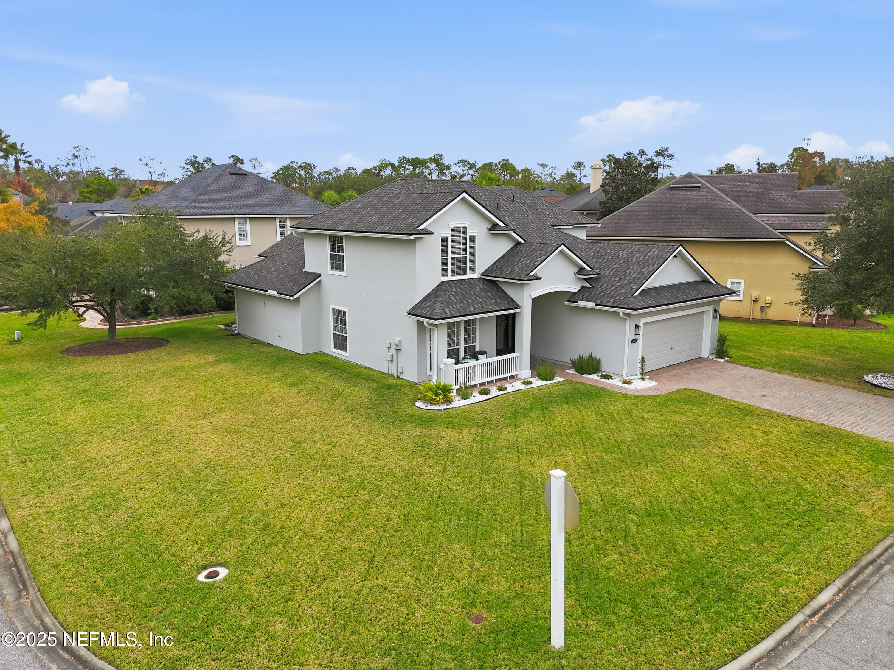 2301 Country Side Drive Fleming Island, FL 32003 - Photo 40 of 58 a aerial view of a house with a big yard and large trees