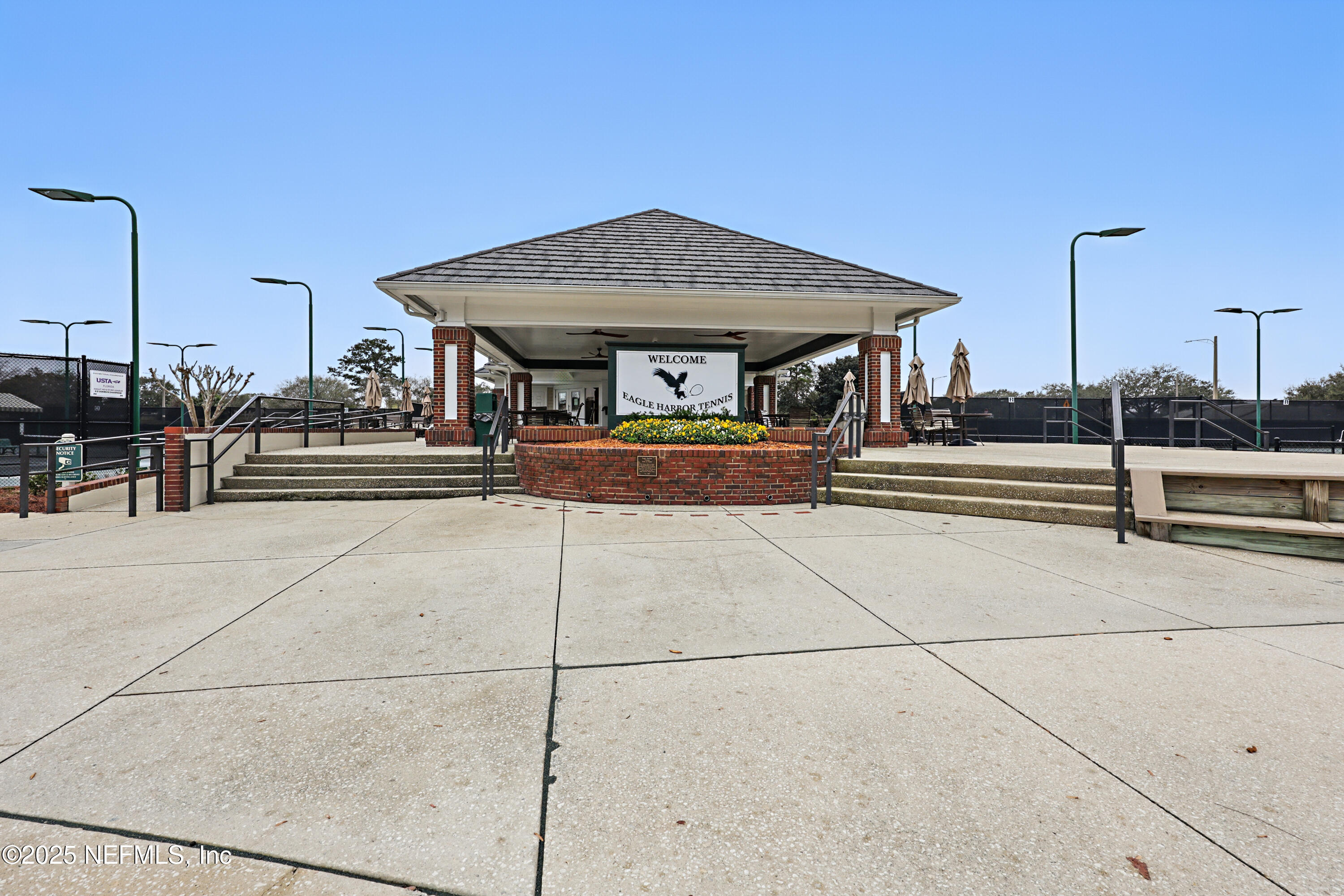 2301 Country Side Drive Fleming Island, FL 32003 - Photo 50 of 58 a front view of a building with parking space