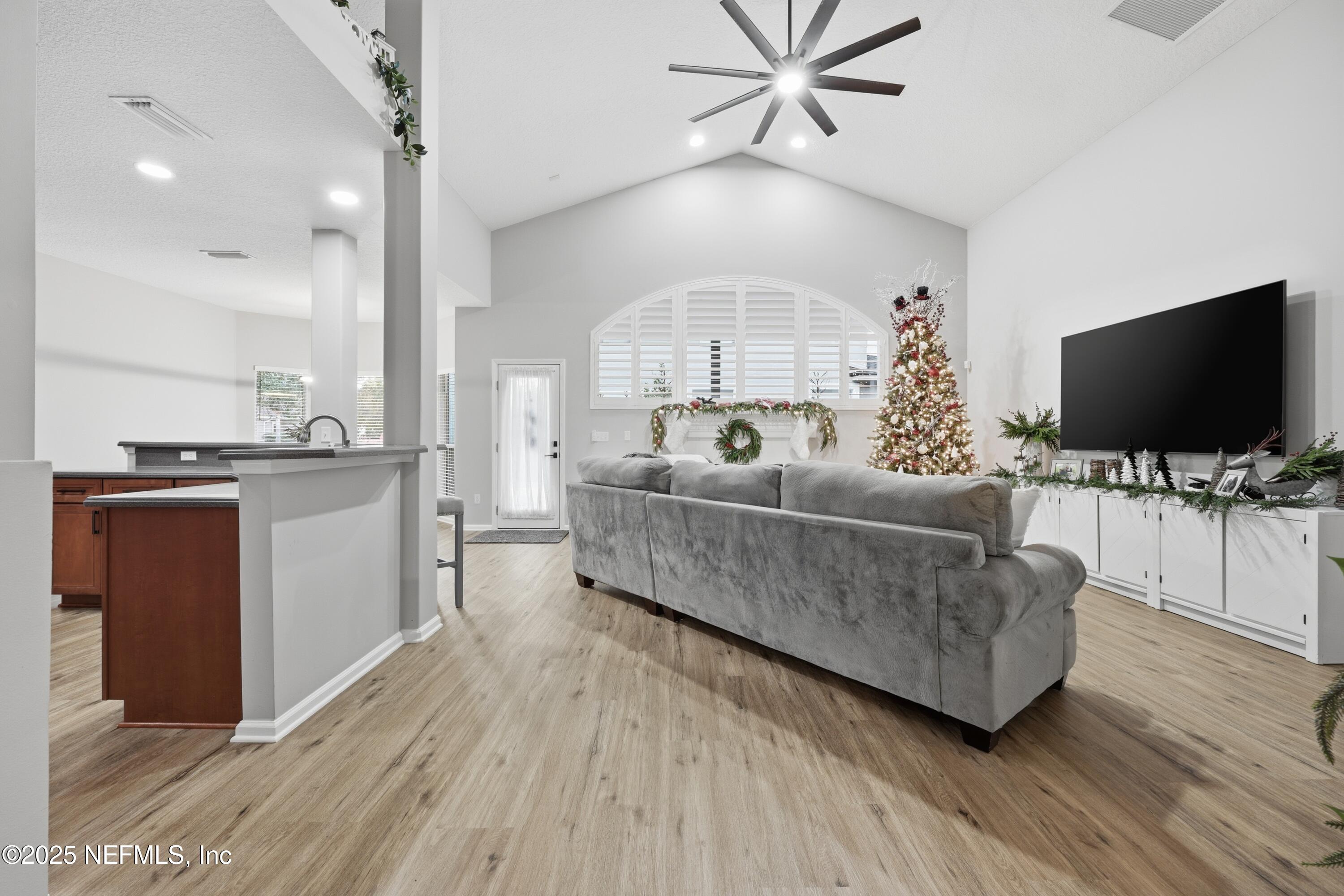 2301 Country Side Drive Fleming Island, FL 32003 - Photo 10 of 58 a living room with furniture and a flat screen tv