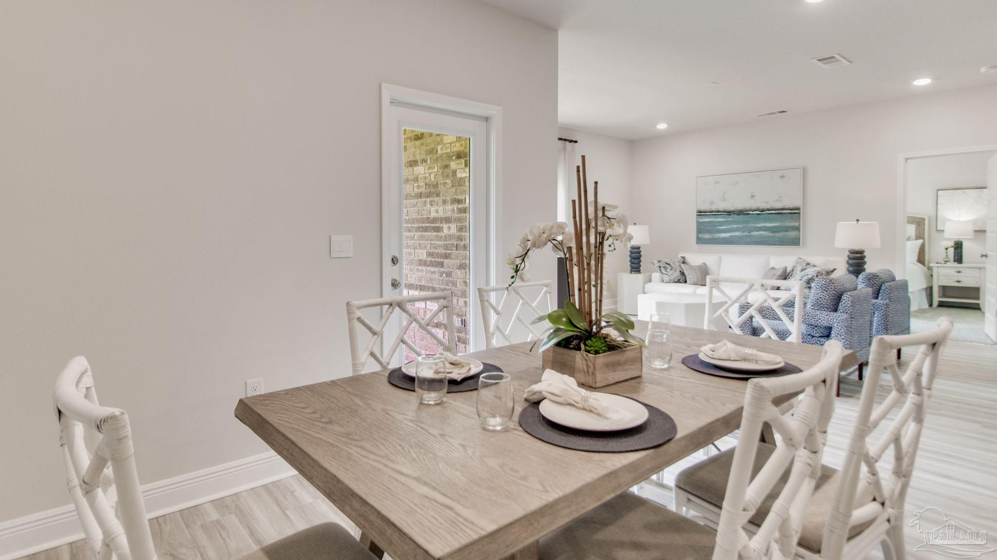 132 Albatross Street Cantonment, FL 32533 - Photo 11 of 35 a table and chairs in a room