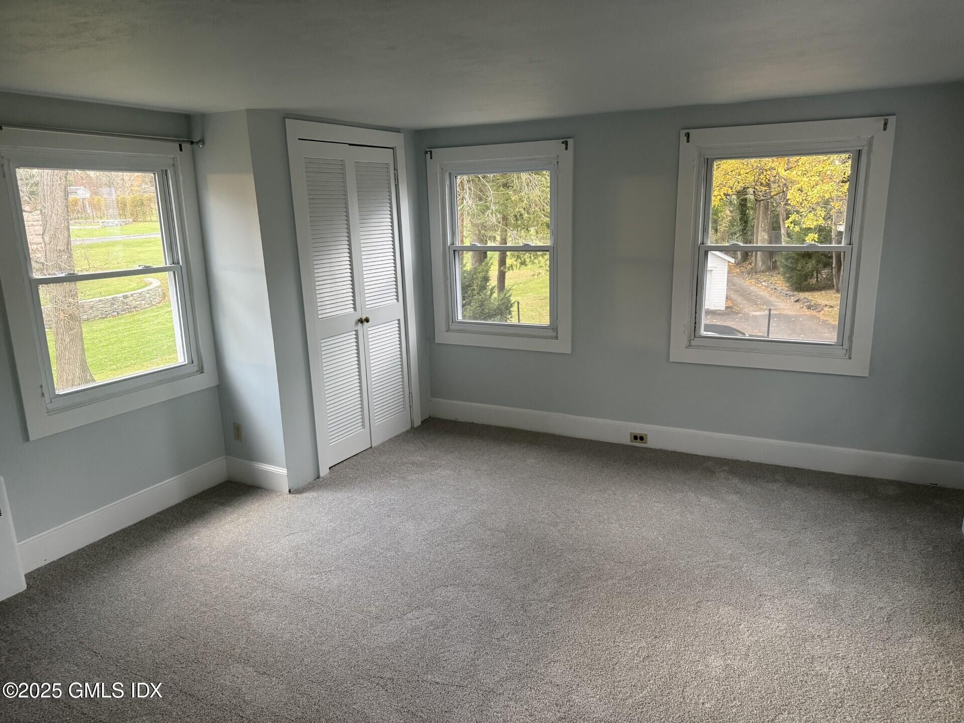 33 Parsonage Road Greenwich, CT 06830 - Photo 7 of 14 an empty room with windows