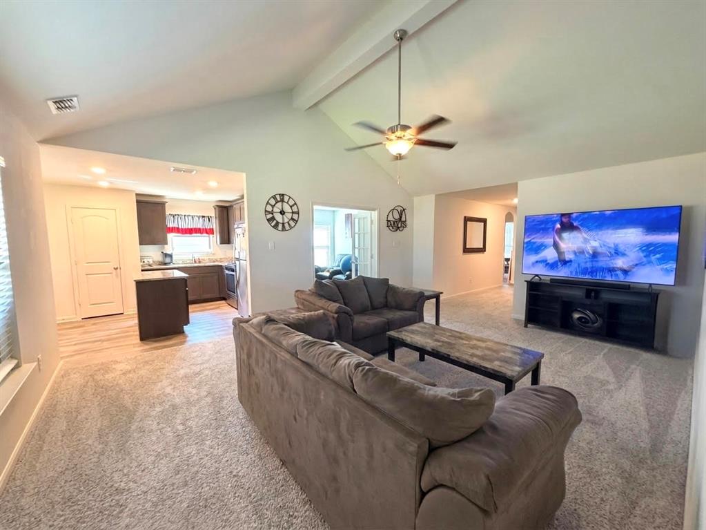 13604 Mineral Road Ponder, TX 76259 - Photo 3 of 20 Living room with light carpet and a ceiling fan