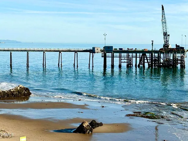 a view of swimming pool with outdoor seating