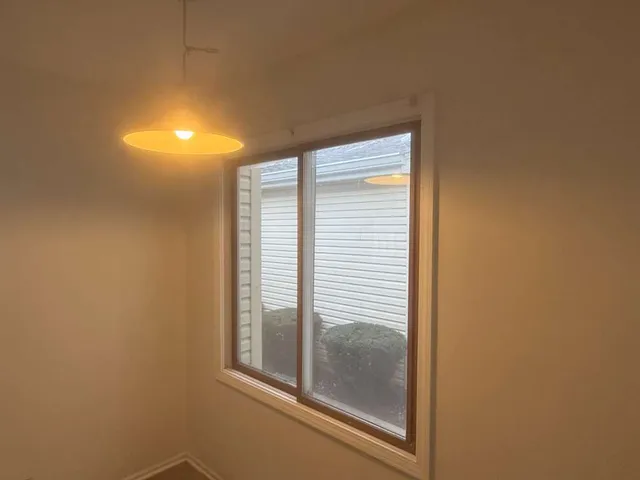 a view of a room that has a window in it