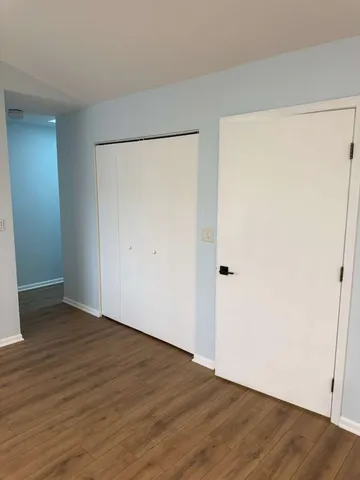 an empty room with wooden floor