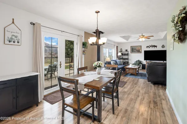 a view of a dining room with furniture window and wooden floor