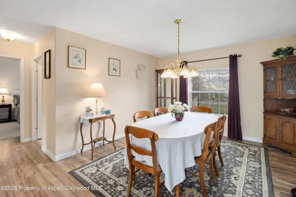 a view of a dining room with furniture window and wooden floor