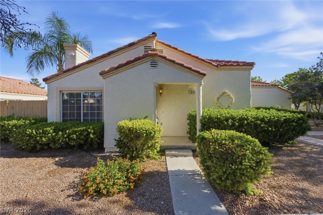 5449 Bugle Way, Unit 104 Las Vegas, NV 89108 - Photo 2 of 33 This charming home offers classic Mediterranean architecture with lush, mature landscaping and a welcoming entrance.