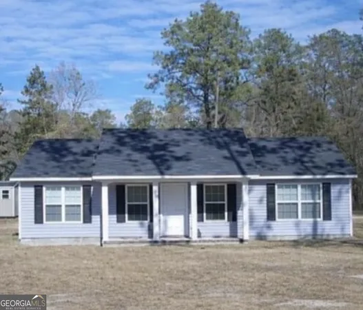 front view of a house with a yard