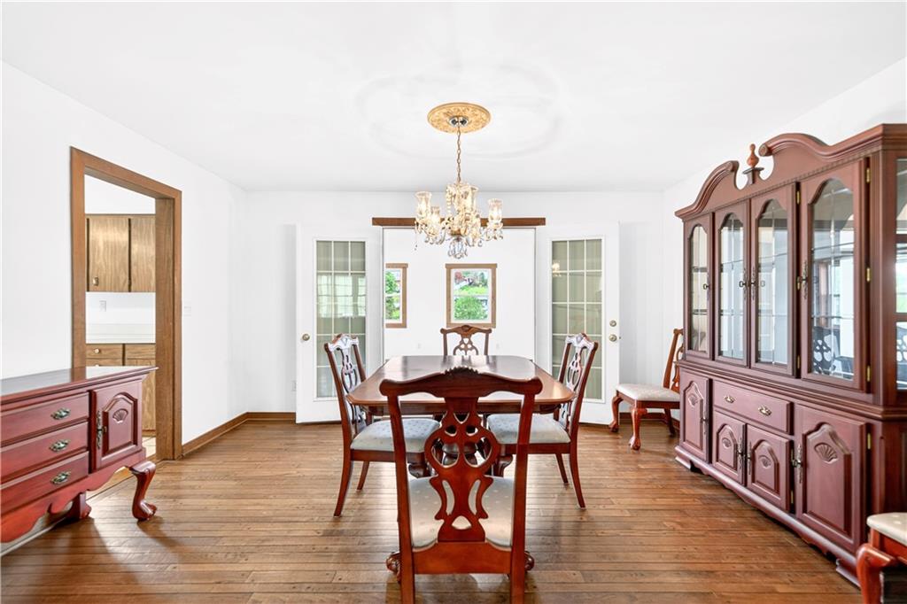 709 Vernon Drive Rostraver Township, PA 15012 - Photo 12 of 40 a view of a dining room with furniture window and wooden floor