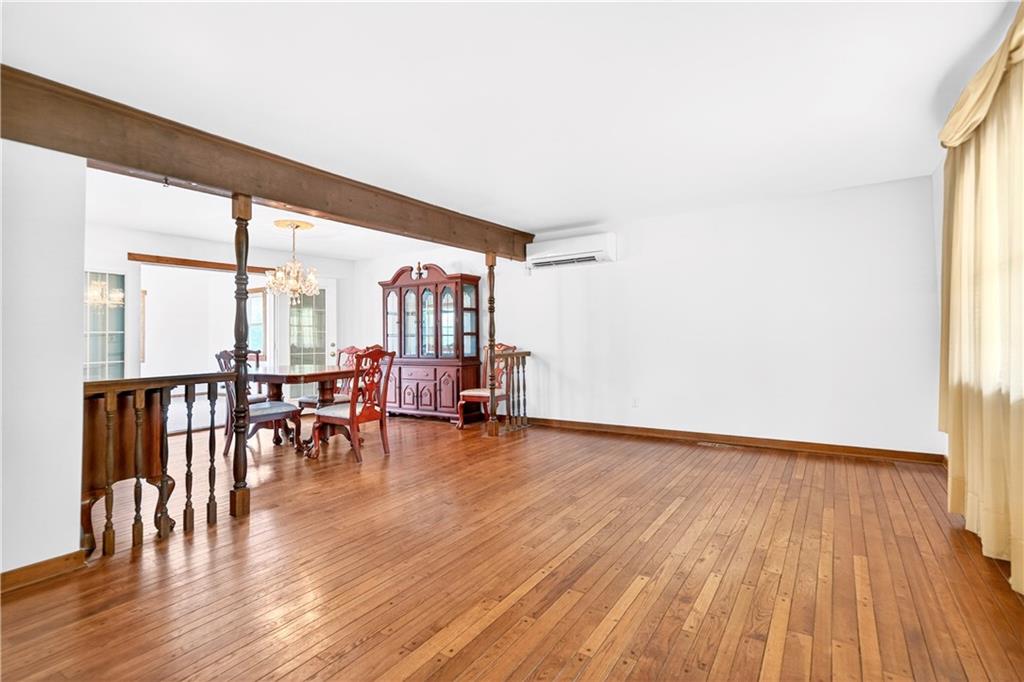709 Vernon Drive Rostraver Township, PA 15012 - Photo 16 of 40 a view of dining room with furniture and wooden floor