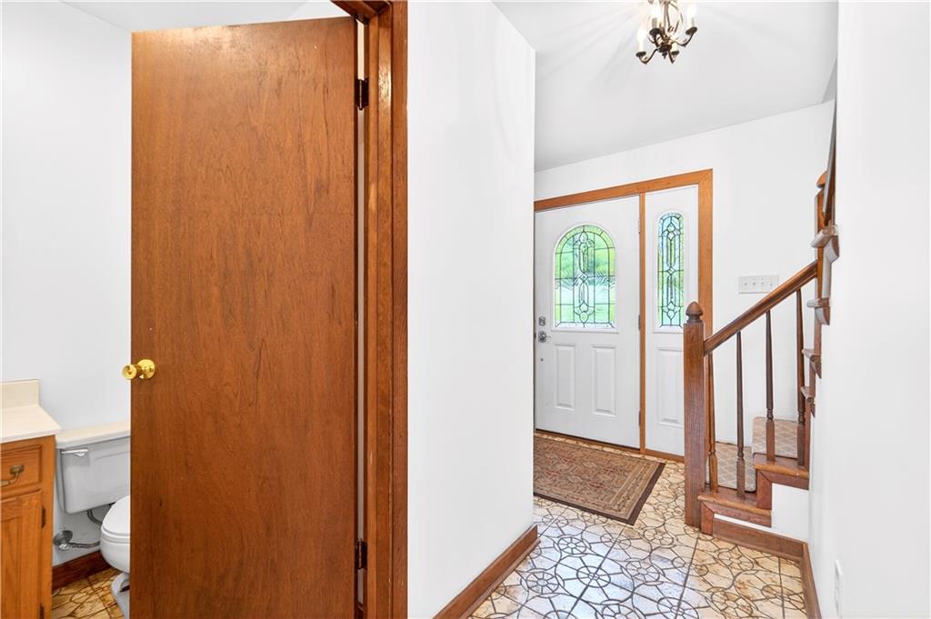 709 Vernon Drive Rostraver Township, PA 15012 - Photo 18 of 40 a view of a hallway with wooden floor and entryway