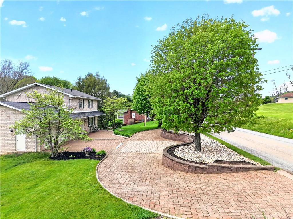 709 Vernon Drive Rostraver Township, PA 15012 - Photo 2 of 40 a swimming pool with outdoor seating and yard