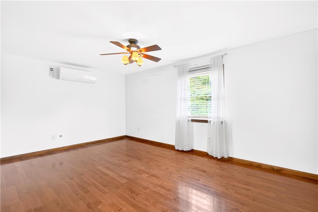 709 Vernon Drive Rostraver Township, PA 15012 - Photo 21 of 40 an empty room with a window and a ceiling fan