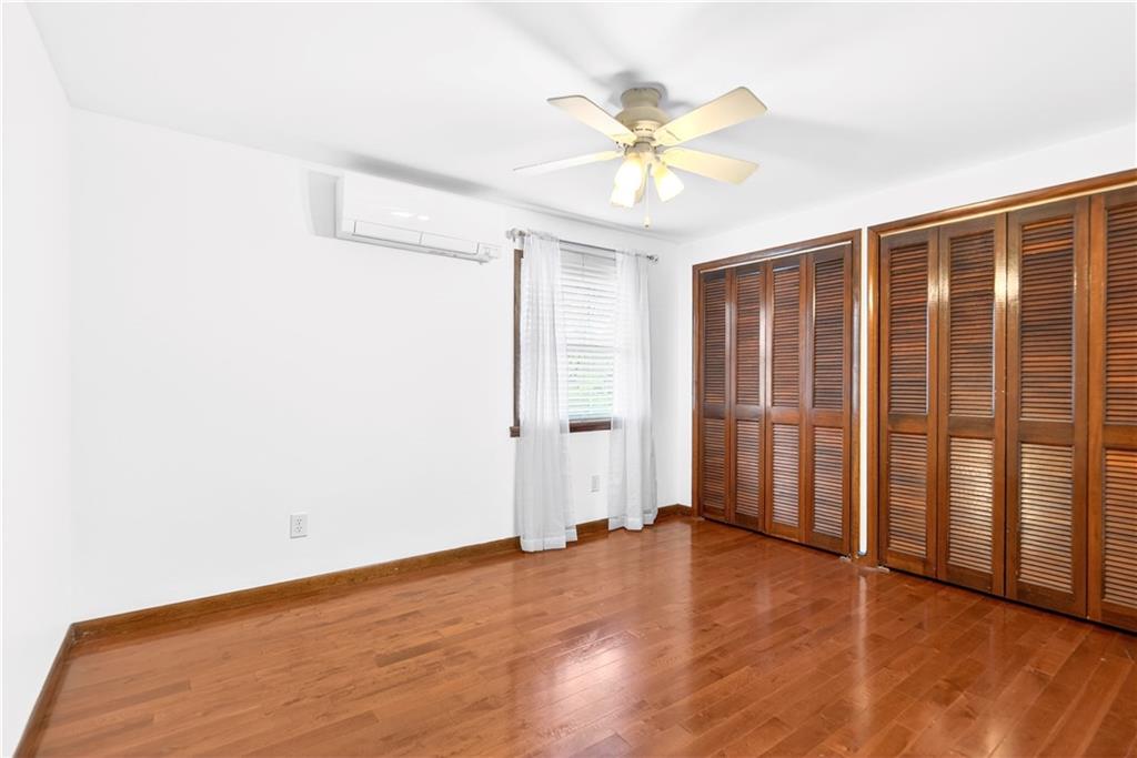 709 Vernon Drive Rostraver Township, PA 15012 - Photo 24 of 40 a view of an empty room with wooden floor