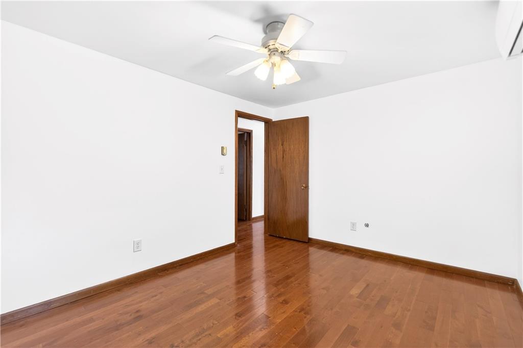 709 Vernon Drive Rostraver Township, PA 15012 - Photo 25 of 40 a view of an empty room with wooden floor