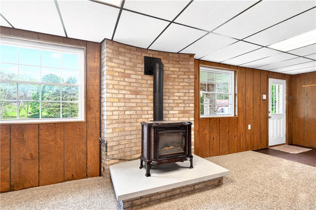 709 Vernon Drive Rostraver Township, PA 15012 - Photo 28 of 40 a living room with furniture a window and a fireplace