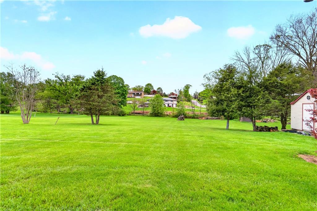 709 Vernon Drive Rostraver Township, PA 15012 - Photo 5 of 40 a view of field with trees in the background