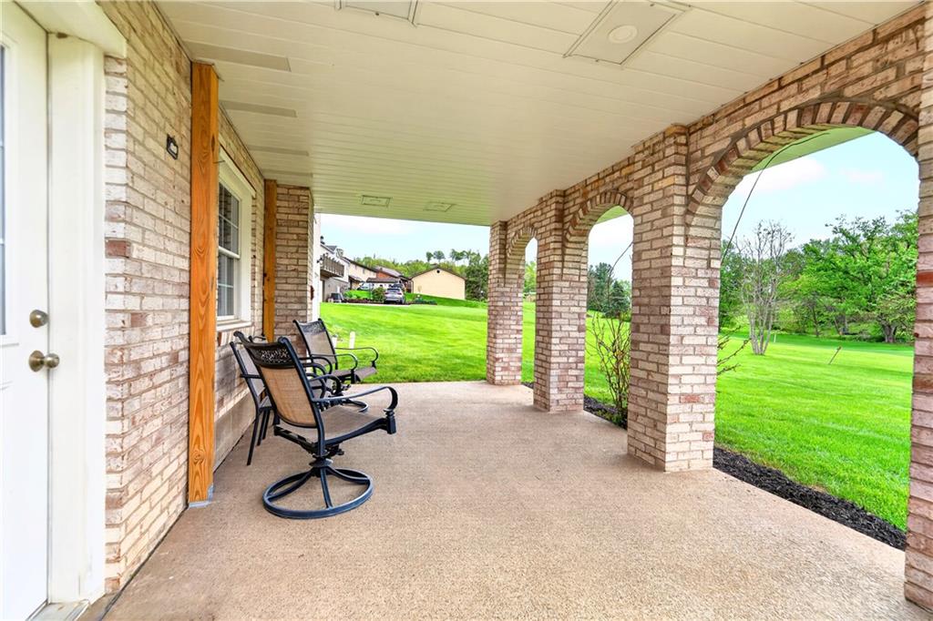709 Vernon Drive Rostraver Township, PA 15012 - Photo 6 of 40 a view of a room with a chairs and table in patio