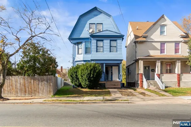 a front view of a house with a porch