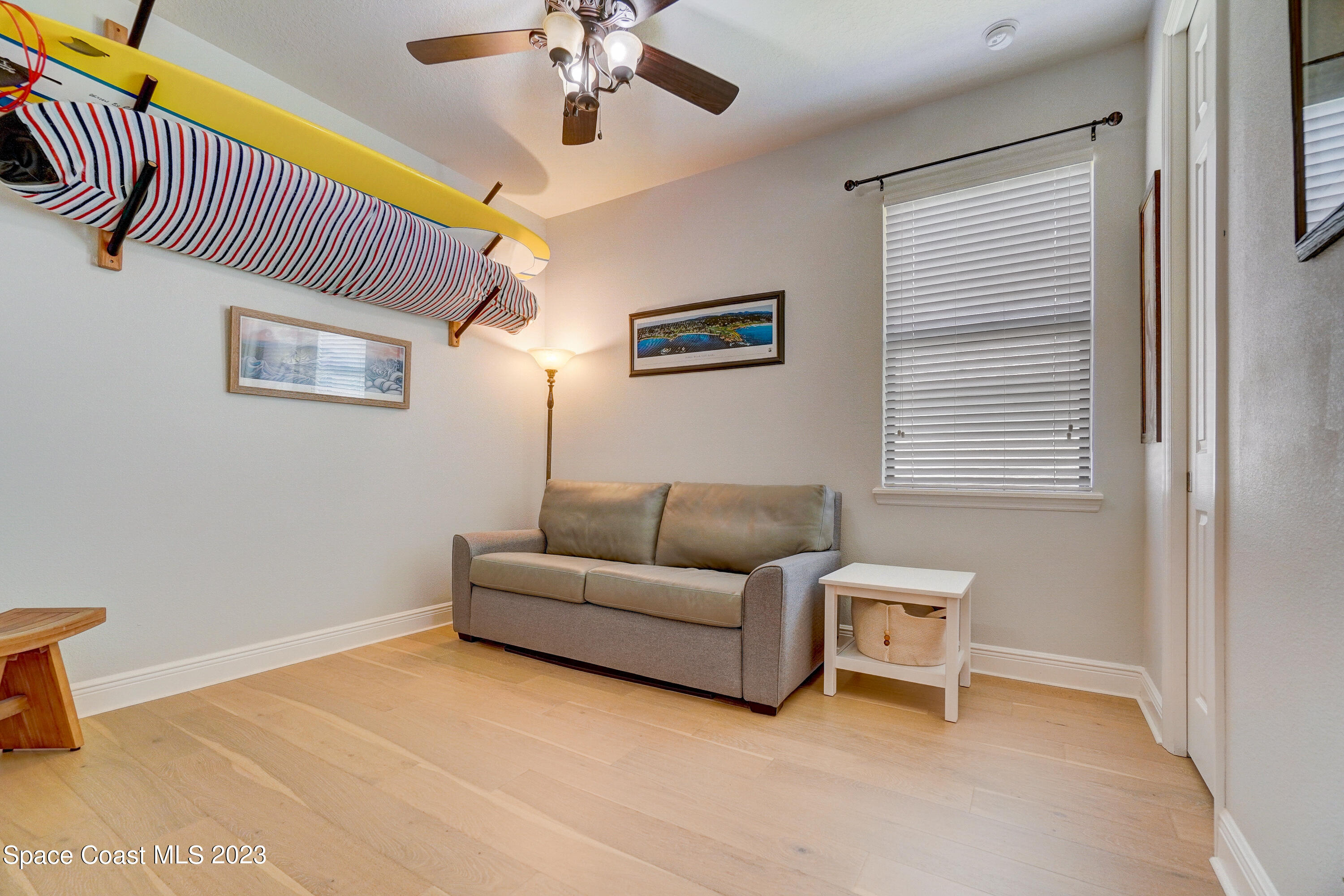 1568 Outrigger Circle Rockledge, FL 32955 - Photo 16 of 44 a living room with furniture and a window