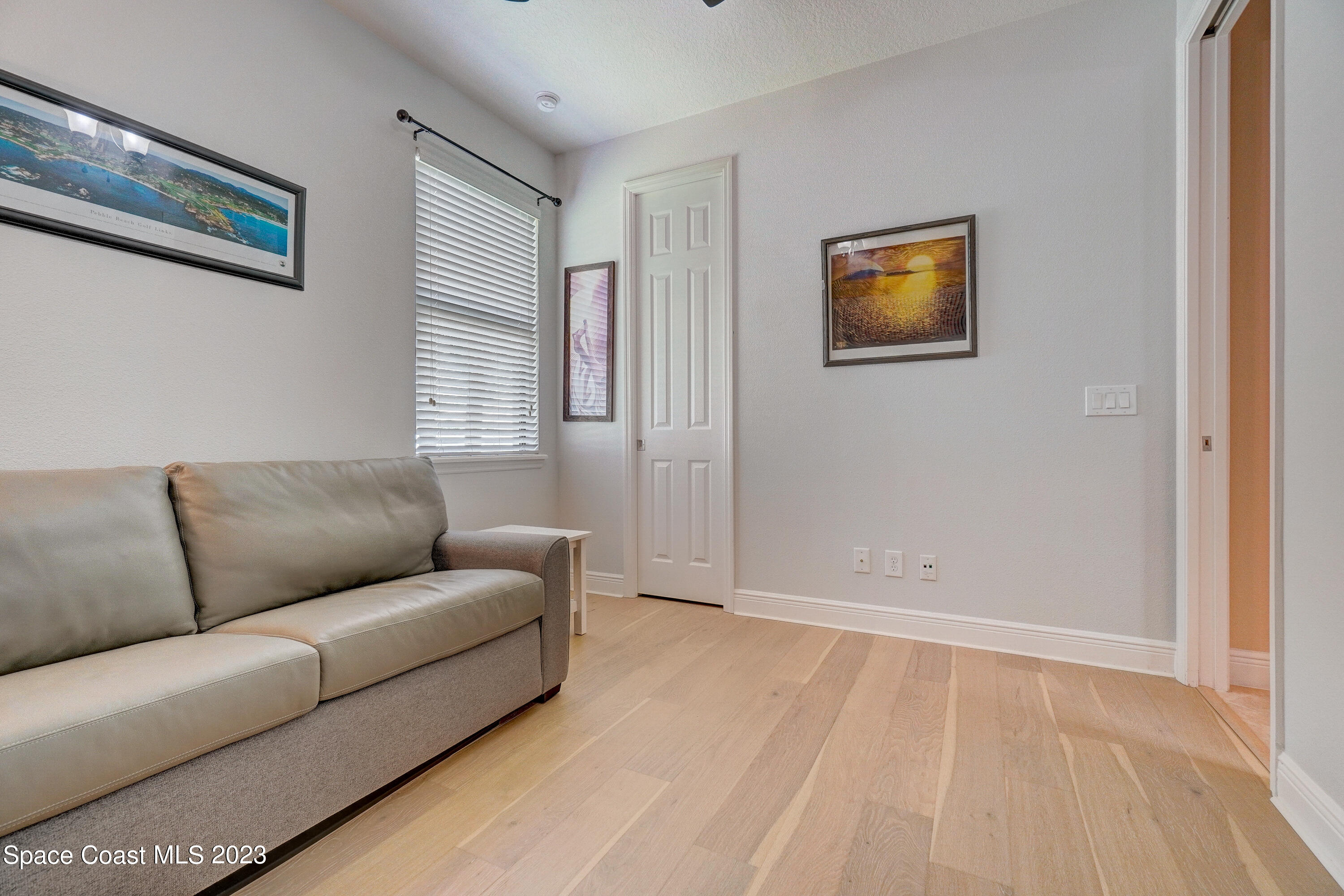 1568 Outrigger Circle Rockledge, FL 32955 - Photo 18 of 44 a living room with furniture and a window