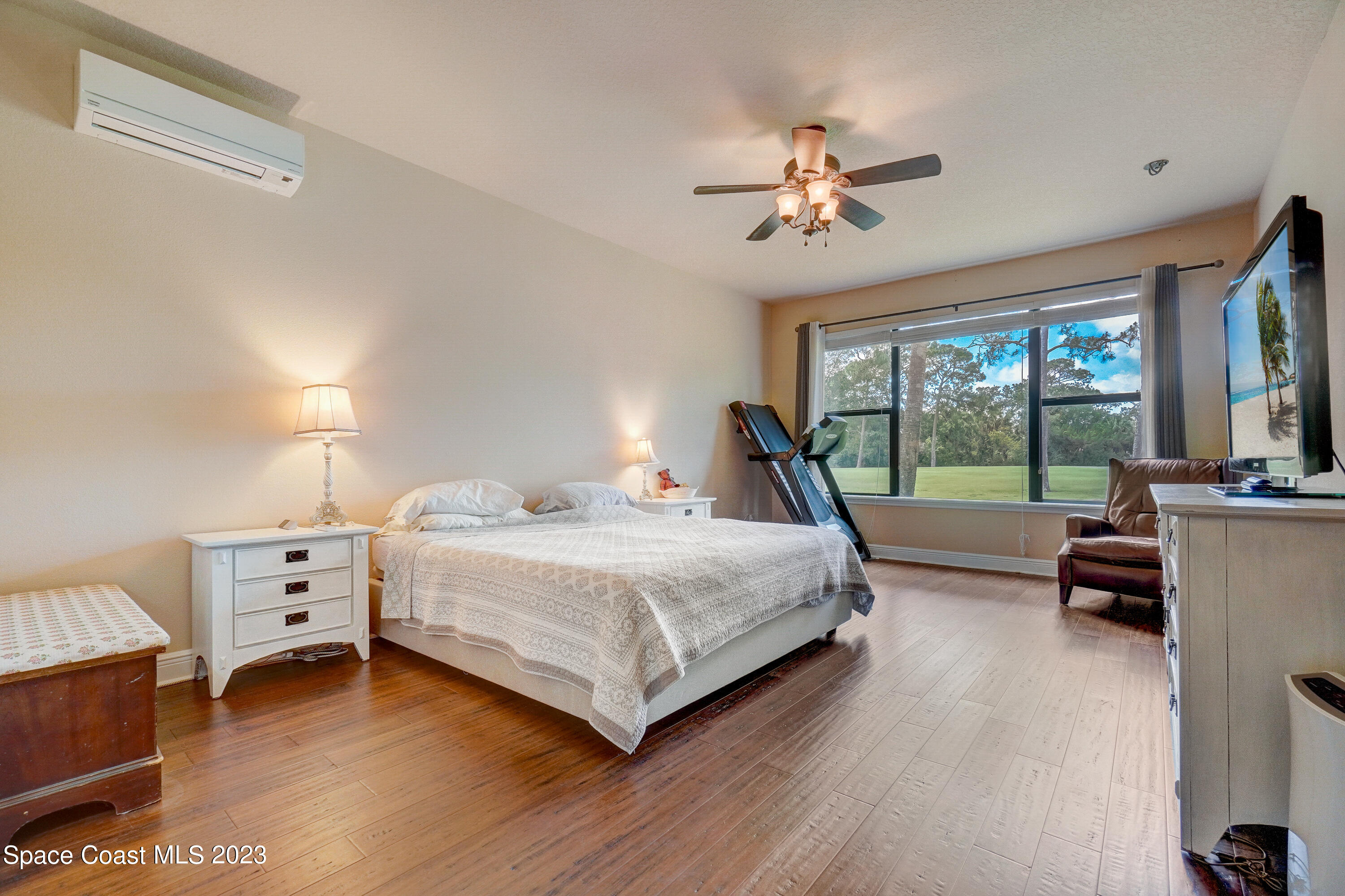 1568 Outrigger Circle Rockledge, FL 32955 - Photo 23 of 44 a spacious bedroom with a bed and a large window