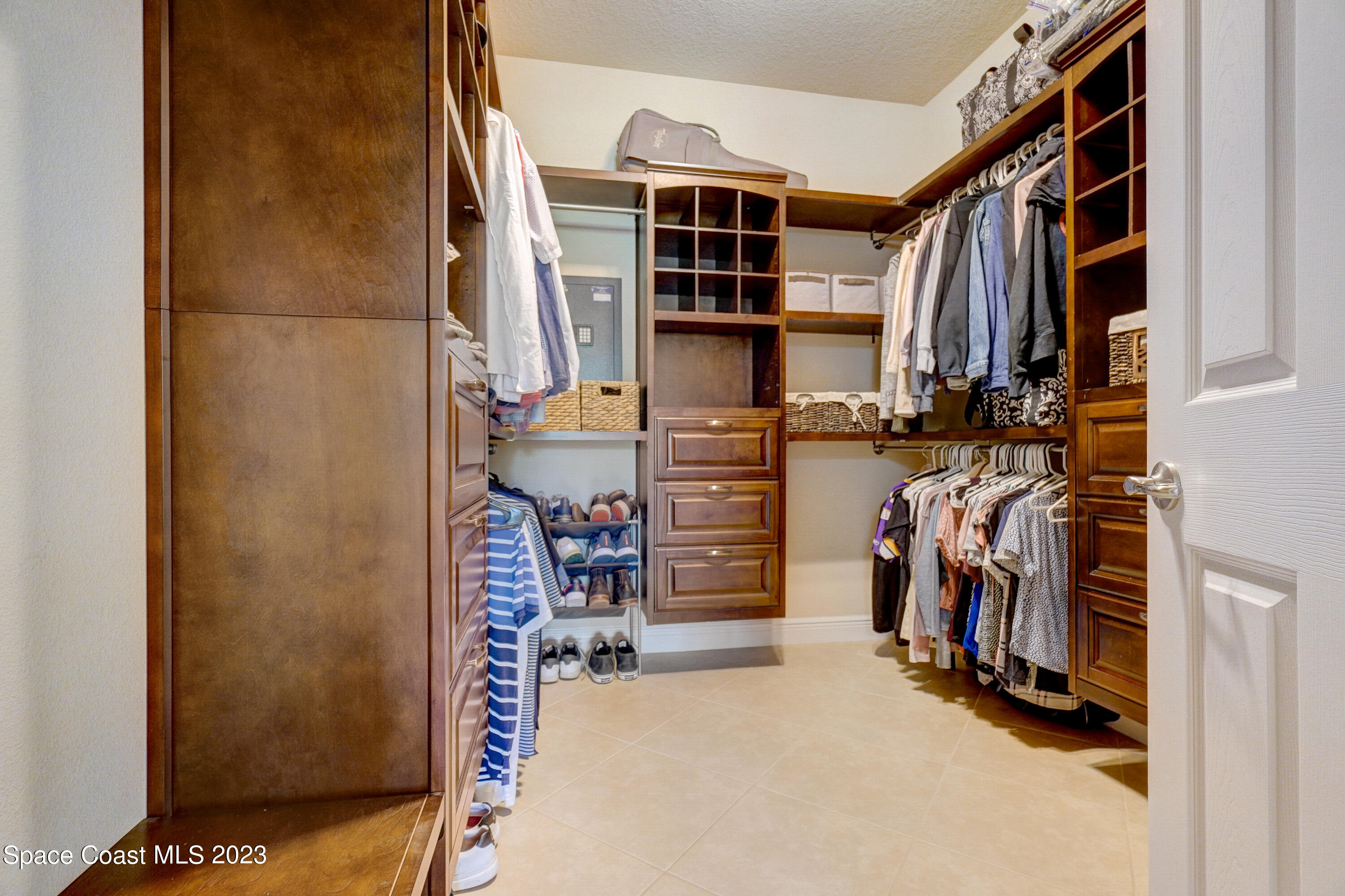 1568 Outrigger Circle Rockledge, FL 32955 - Photo 28 of 44 a view of walk in closet with clothes and shoes