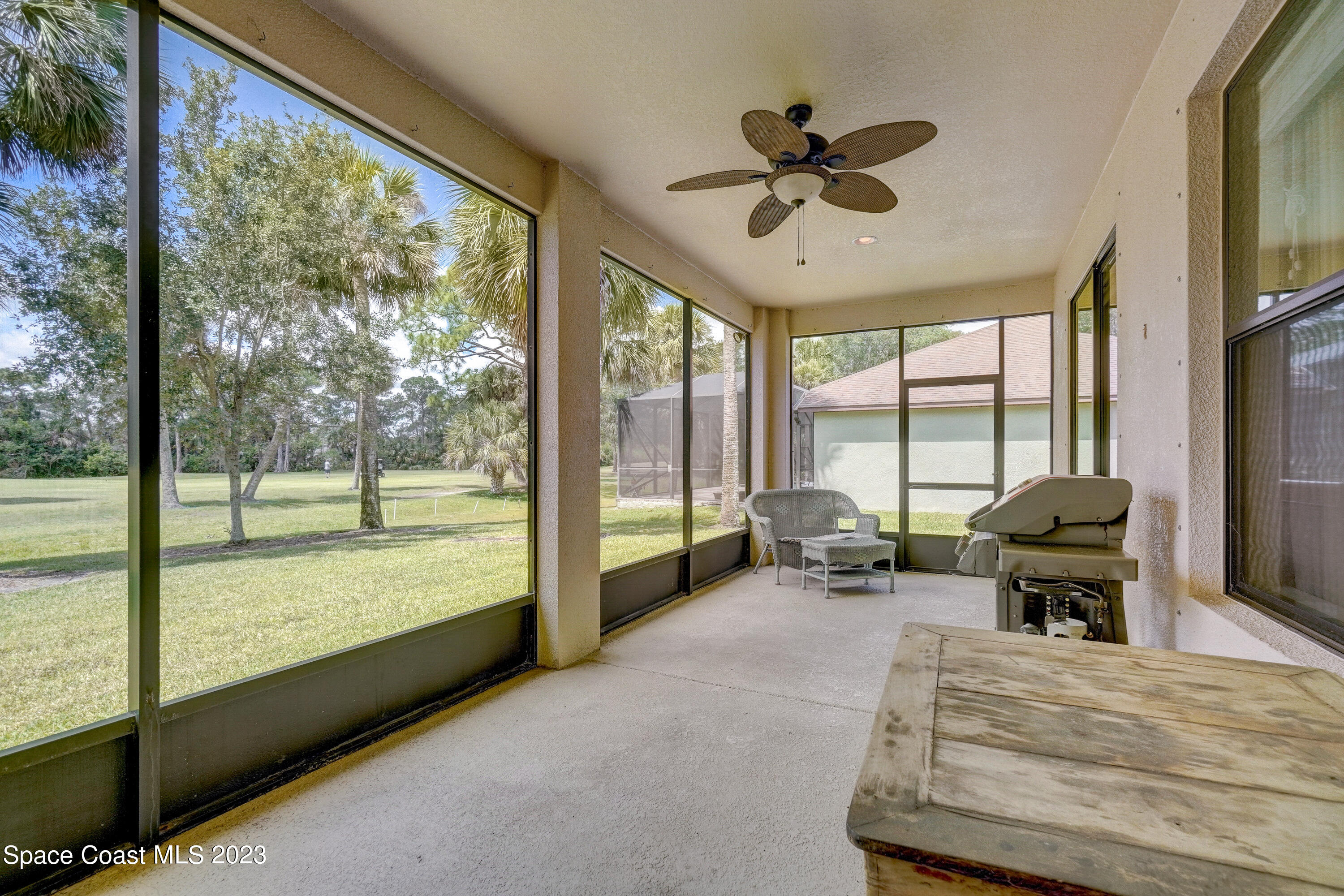 1568 Outrigger Circle Rockledge, FL 32955 - Photo 29 of 44 a living room with hardwood floor and a large window
