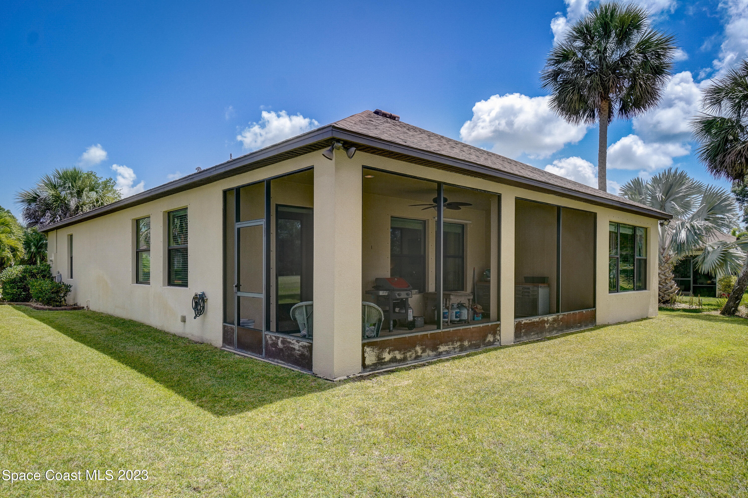 1568 Outrigger Circle Rockledge, FL 32955 - Photo 31 of 44 a view of a house with a yard and potted plants