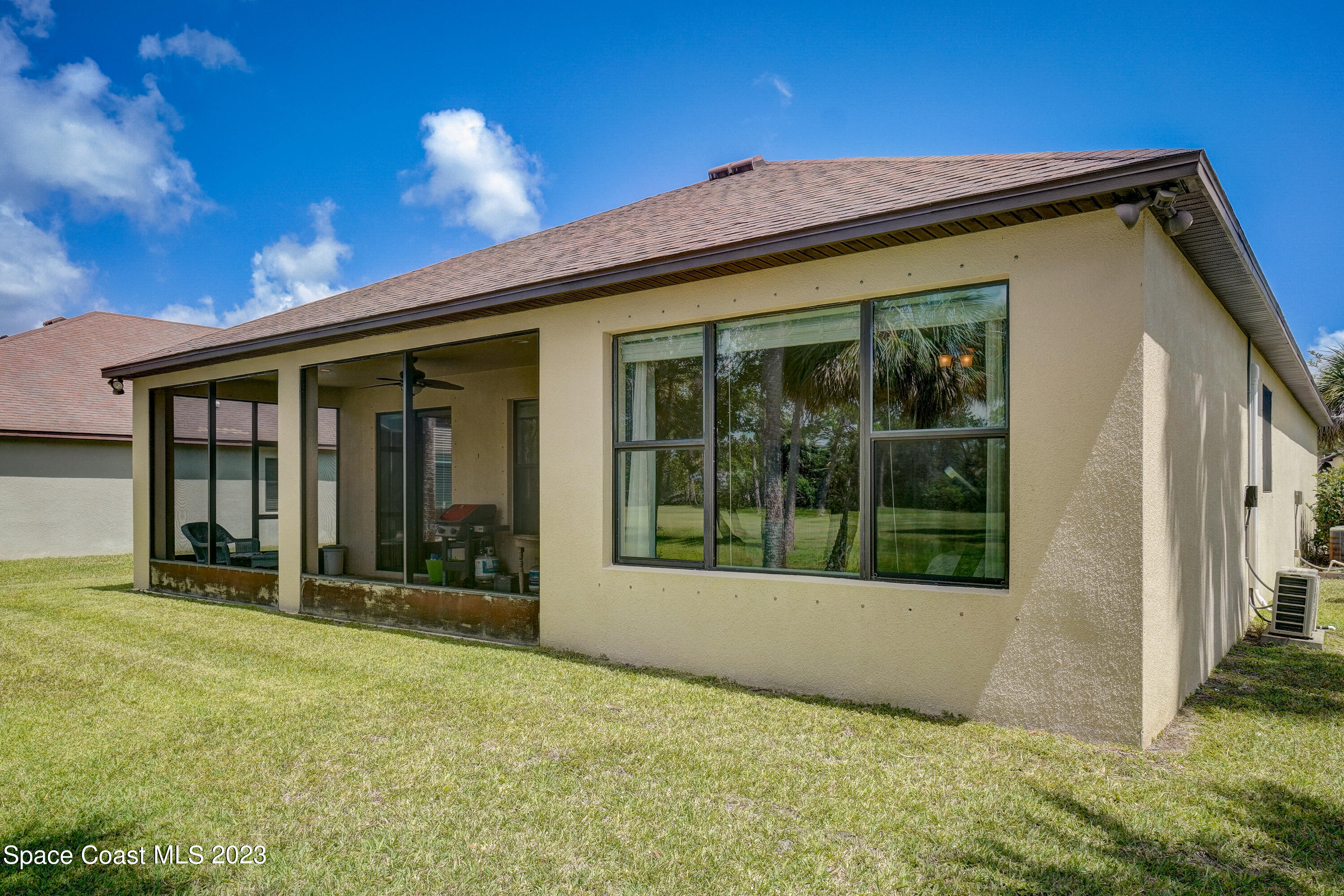 1568 Outrigger Circle Rockledge, FL 32955 - Photo 33 of 44 a view of a house with backyard and porch