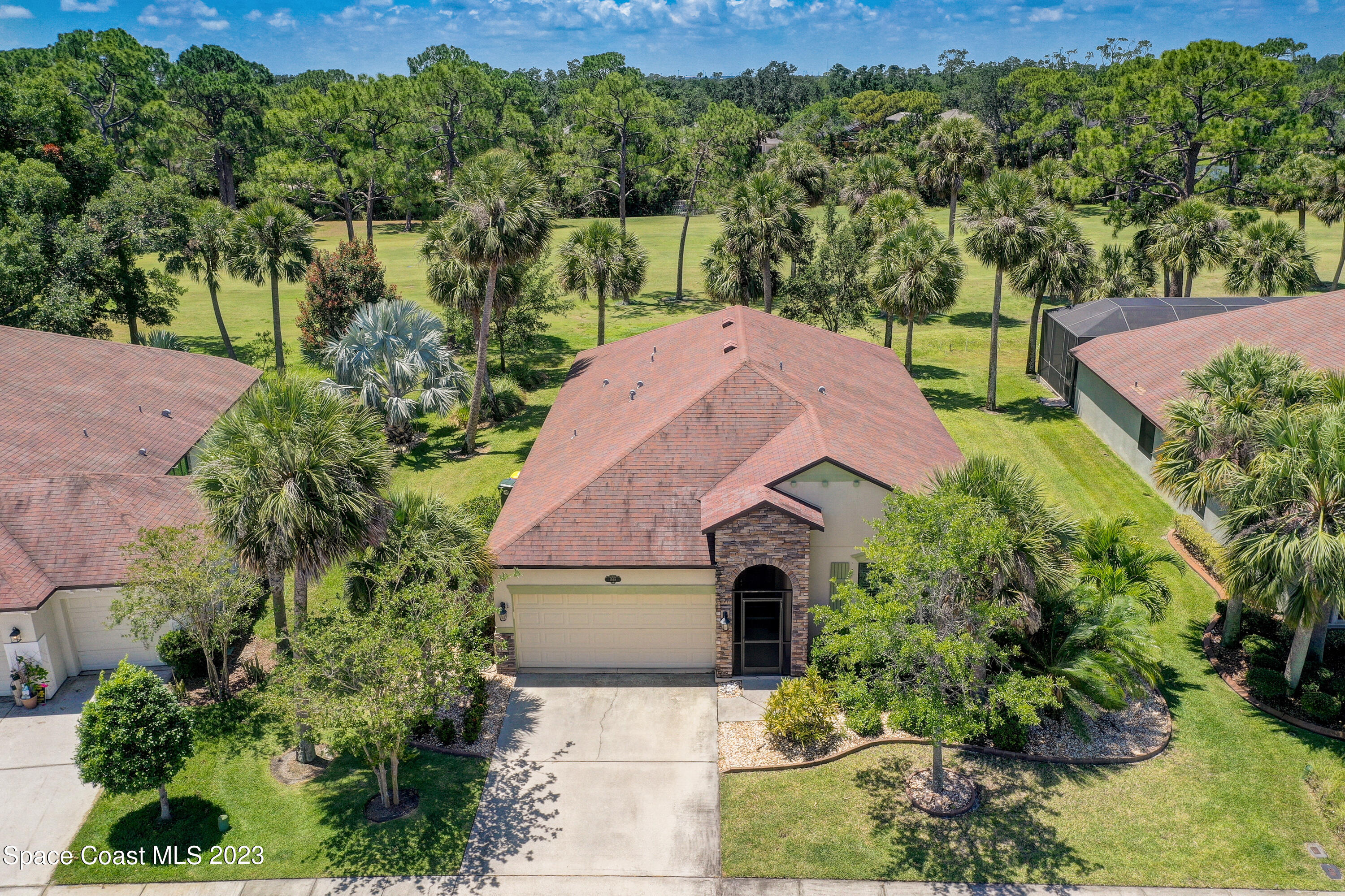 1568 Outrigger Circle Rockledge, FL 32955 - Photo 37 of 44 an aerial view of a house with a yard