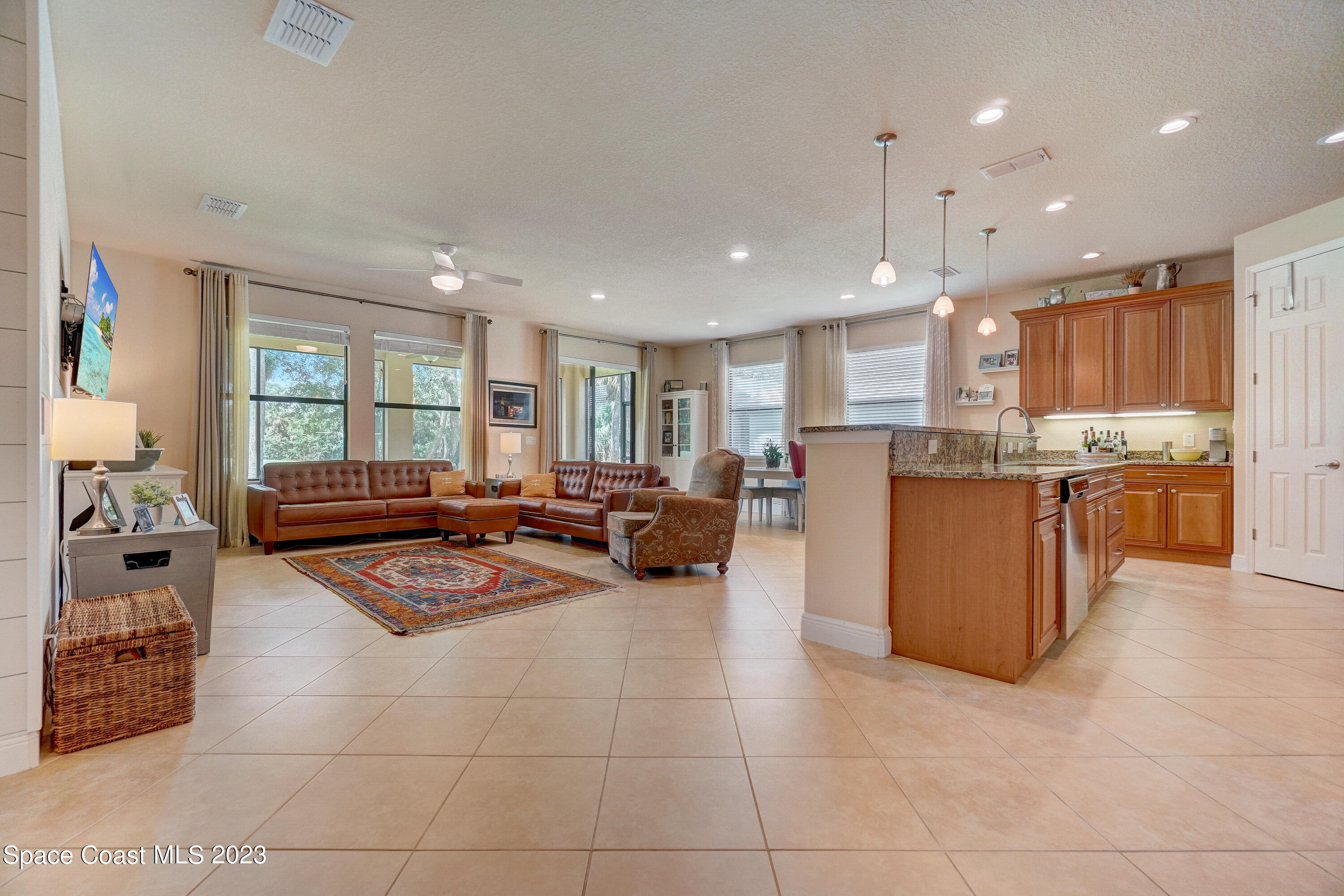 1568 Outrigger Circle Rockledge, FL 32955 - Photo 4 of 44 a living room with stainless steel appliances furniture cabinets and a window