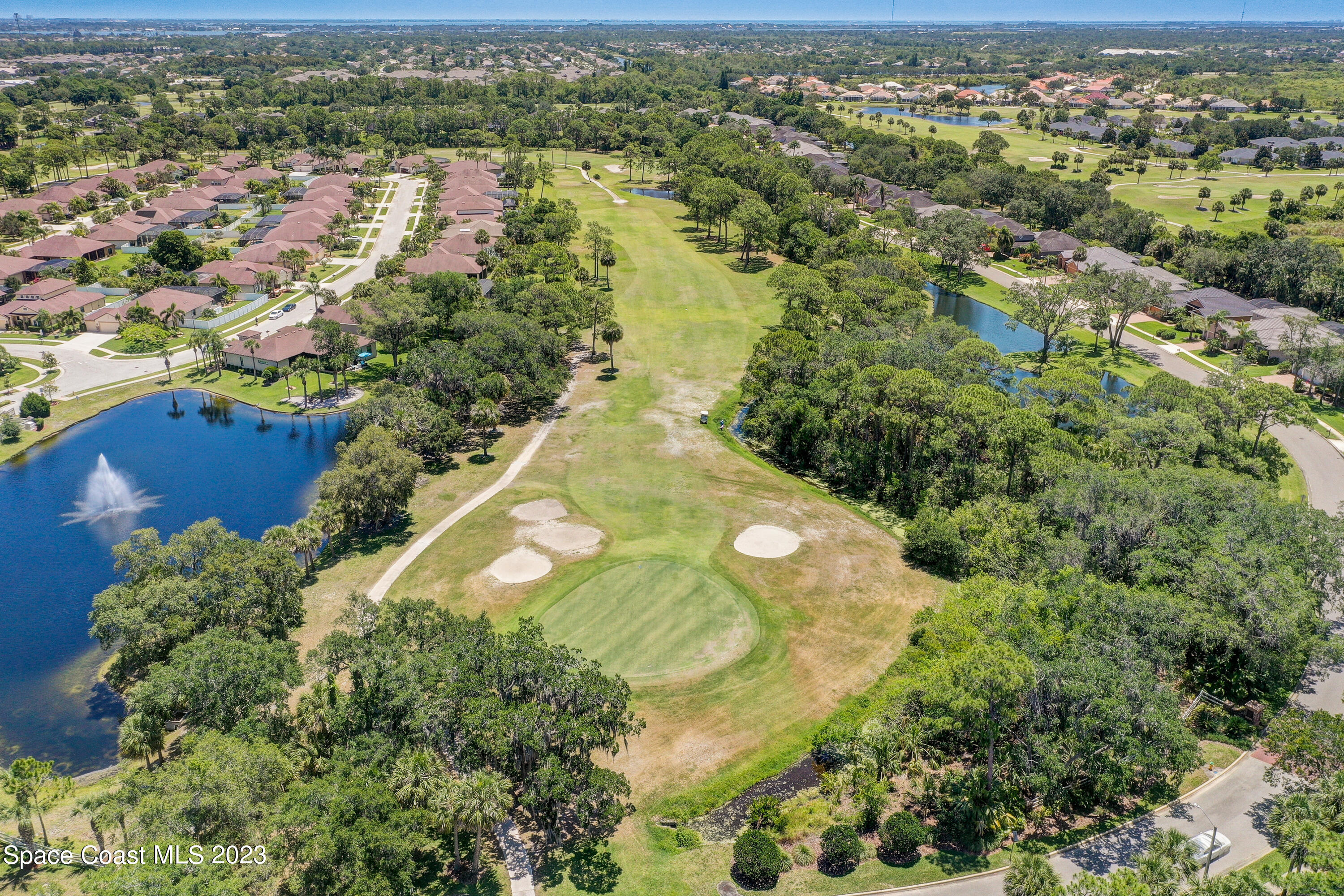 1568 Outrigger Circle Rockledge, FL 32955 - Photo 44 of 44 an aerial view of residential houses with outdoor space and trees