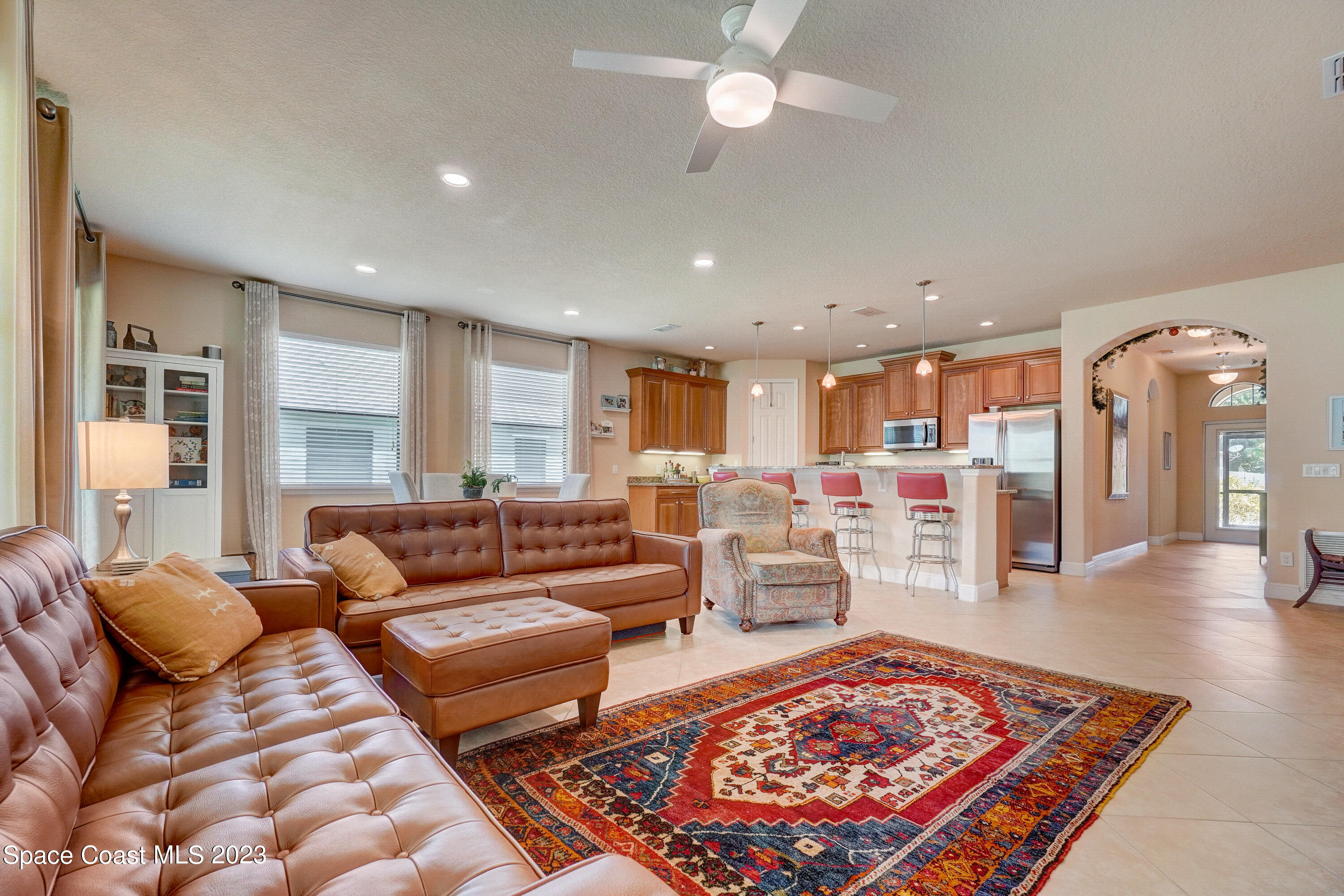 1568 Outrigger Circle Rockledge, FL 32955 - Photo 7 of 44 a living room with furniture and a rug