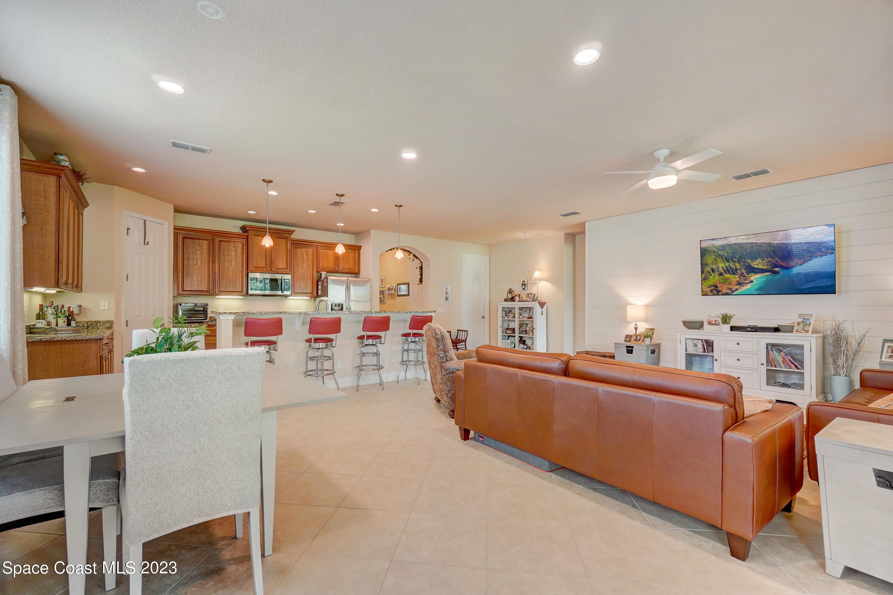 1568 Outrigger Circle Rockledge, FL 32955 - Photo 9 of 44 a living room with furniture and a flat screen tv