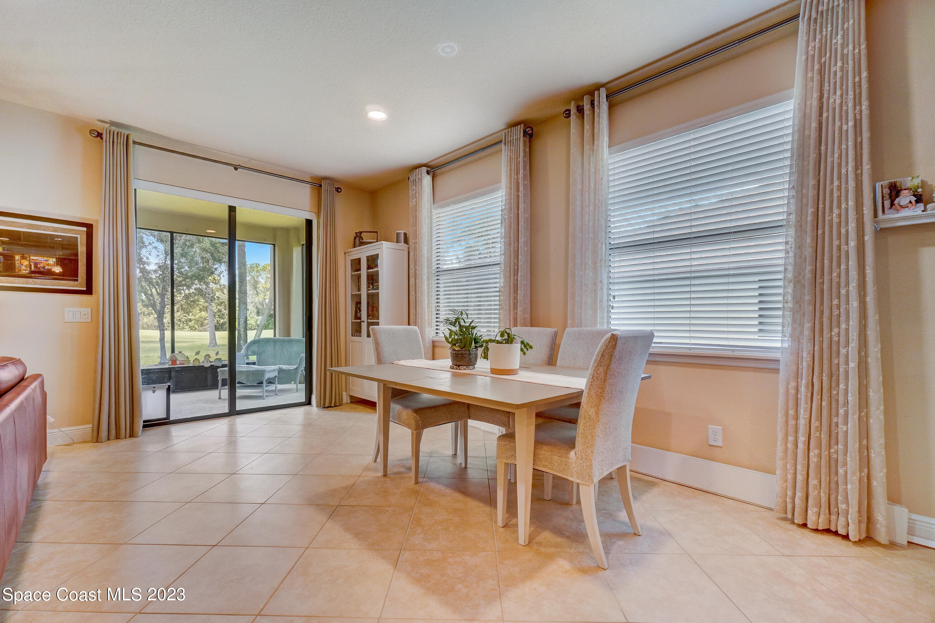 1568 Outrigger Circle Rockledge, FL 32955 - Photo 10 of 44 a dining room with furniture and window