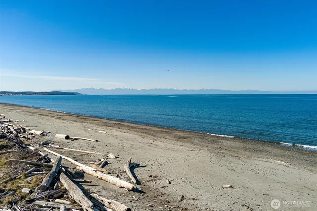 a picture of a bench in front of a white house