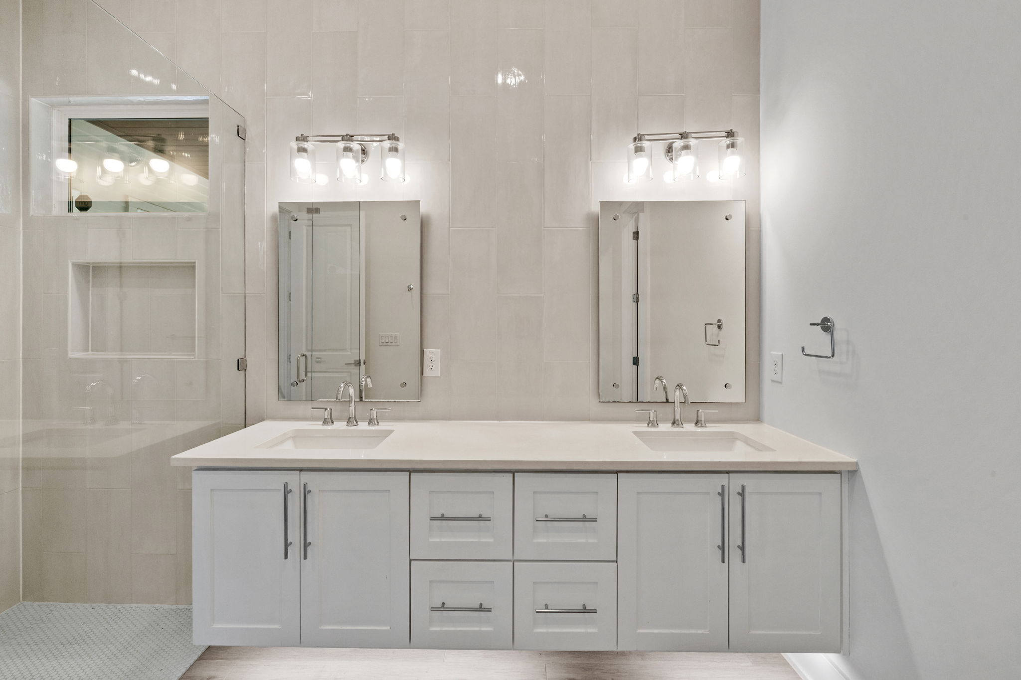 1719 Bunche Road Austin, TX 78721 - Photo 18 of 36 Clean lines and a spacious dual vanity define this modern bathroom.