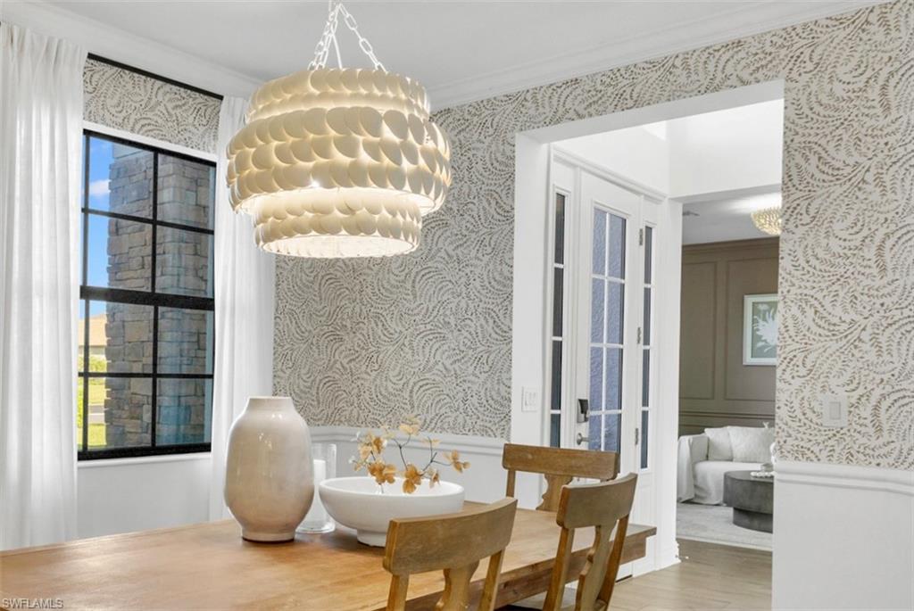 20507 Napa Loop Estero, FL 33928 - Photo 13 of 49 a view of a dining room with furniture and a window