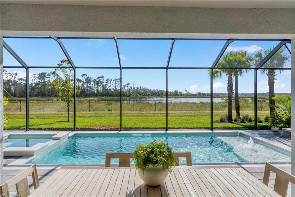 20507 Napa Loop Estero, FL 33928 - Photo 19 of 49 a view of a backyard with couches plants and wooden fence