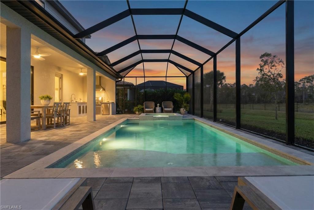 20507 Napa Loop Estero, FL 33928 - Photo 21 of 49 a swimming pool with a yard