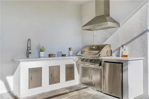 a kitchen with a stove and a sink