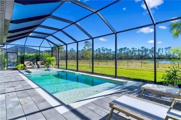a view of a backyard with sitting area
